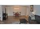 Open-concept living space featuring a dining area with seating and a decorative light fixture at 10444 N 69Th St # 128, Paradise Valley, AZ 85253
