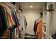 Organized walk-in closet with ample storage, hanging rods, shelves, and shoe racks at 10444 N 69Th St # 128, Paradise Valley, AZ 85253