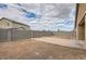 Large backyard with block fencing and partially xeriscaped space, ready for landscaping at 10528 W Crown King Rd, Tolleson, AZ 85353