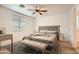 Calm bedroom with a ceiling fan and ample natural light, providing a serene retreat for rest and rejuvenation at 10528 W Crown King Rd, Tolleson, AZ 85353