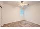 Neutral bedroom featuring carpet, a ceiling fan, and a bright window at 10528 W Crown King Rd, Tolleson, AZ 85353