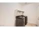 Efficient laundry room with modern washer and dryer units for easy chore completion at 10528 W Crown King Rd, Tolleson, AZ 85353
