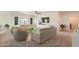 Bright living room with neutral tones, offering a comfortable setting for relaxation and entertaining at 10528 W Crown King Rd, Tolleson, AZ 85353