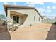 Exterior view of home showcasing covered patio with a large backyard area at 10961 W Taylor St, Avondale, AZ 85323