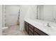 Bathroom featuring neutral countertops and cabinets, with a tub and shower combo at 10961 W Taylor St, Avondale, AZ 85323