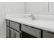 Bathroom vanity with neutral cabinets, hardware, white countertop and stylish faucet at 10961 W Taylor St, Avondale, AZ 85323