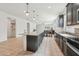 Spacious kitchen featuring an island, stainless steel appliances, and stylish countertops at 10961 W Taylor St, Avondale, AZ 85323