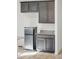 Kitchenette featuring stainless steel refrigerator and granite countertops at 10961 W Taylor St, Avondale, AZ 85323