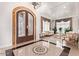 Elegant foyer showcases a decorative floor, chandelier, and a grand entryway to the living room at 11054 E North Ln, Scottsdale, AZ 85259