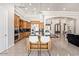 Open kitchen with a large island with seating, opening to the dining area at 11054 E North Ln, Scottsdale, AZ 85259