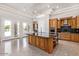 Bright kitchen with island seating, stainless appliances, and lots of storage at 11054 E North Ln, Scottsdale, AZ 85259