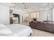 Bright main bedroom with fireplace, seating, and private access to the bathroom at 11054 E North Ln, Scottsdale, AZ 85259