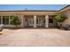 A patio space with a red tiled roof, pillars and seating at 11054 E North Ln, Scottsdale, AZ 85259