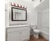 Bathroom featuring a tub, vanity, and framed mirror with vanity lighting at 1159 W Emelita Ave, Mesa, AZ 85210