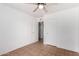 This bedroom features tile floors, ceiling fan and 2 large white doors at 1159 W Emelita Ave, Mesa, AZ 85210