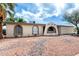 Charming one-story home featuring unique architectural details and desert-friendly landscaping at 1159 W Emelita Ave, Mesa, AZ 85210
