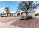 Charming one-story home featuring unique architectural details and desert-friendly landscaping at 1159 W Emelita Ave, Mesa, AZ 85210
