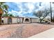 Charming one-story home featuring unique architectural details and desert-friendly landscaping at 1159 W Emelita Ave, Mesa, AZ 85210