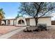 Charming one-story home featuring unique architectural details and desert-friendly landscaping at 1159 W Emelita Ave, Mesa, AZ 85210