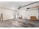 Two car garage with automatic door, concrete floors and white cinder block walls at 1159 W Emelita Ave, Mesa, AZ 85210