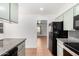 A view of the kitchen features granite countertops and newer appliances at 1159 W Emelita Ave, Mesa, AZ 85210