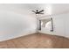 Bright living room with tile flooring, neutral paint, a ceiling fan, and natural light at 1159 W Emelita Ave, Mesa, AZ 85210