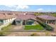 A fenced backyard with artificial turf and patio offers the perfect outdoor experience. Mountain views abound at 11910 E Amanda Rd, Gold Canyon, AZ 85118
