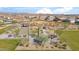 A community park featuring ramadas, a pickle ball court, and bocce ball courts from an aerial view at 11910 E Amanda Rd, Gold Canyon, AZ 85118