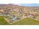 The community park with picnic tables, fire pits, bocce ball, and walking paths beneath a mountain view at 11910 E Amanda Rd, Gold Canyon, AZ 85118