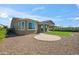 Charming backyard featuring a paved patio, artificial turf, and a neutral-toned exterior at 11910 E Amanda Rd, Gold Canyon, AZ 85118