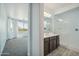 Bathroom featuring a walk-in shower, a single vanity with dark cabinets and ample space at 11910 E Amanda Rd, Gold Canyon, AZ 85118