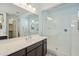 Bathroom with a glass enclosed walk-in shower and vanity with modern fixtures at 11910 E Amanda Rd, Gold Canyon, AZ 85118