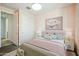 Staged bedroom with plush carpeting, a spacious closet, and a window for natural light at 11910 E Amanda Rd, Gold Canyon, AZ 85118