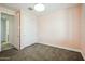 Cozy bedroom with plush carpeting, a spacious closet, and a window for natural light at 11910 E Amanda Rd, Gold Canyon, AZ 85118