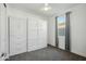 Comfortable bedroom with built-in wardrobe, window, ceiling fan, and cozy carpeting, offering style and functionality at 11910 E Amanda Rd, Gold Canyon, AZ 85118