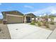 Charming single-Gathering home featuring a spacious 2-car garage, landscaped front yard, and covered porch at 11910 E Amanda Rd, Gold Canyon, AZ 85118