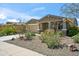 Charming single-story home featuring a low maintenance yard and a two-car garage at 11910 E Amanda Rd, Gold Canyon, AZ 85118
