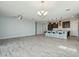 Spacious open-concept living area and kitchen with ample lighting at 11910 E Amanda Rd, Gold Canyon, AZ 85118