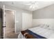 This bedroom has an ensuite, ceiling fan, and a double door closet for ample storage at 1347 E Vernoa St, San Tan Valley, AZ 85140