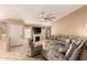 Inviting living room boasts a fireplace, and a comfortable sectional couch, perfect for relaxation at 1347 E Vernoa St, San Tan Valley, AZ 85140