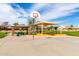 Community playground featuring a basketball court, covered picnic area, and modern play equipment at 1347 E Vernoa St, San Tan Valley, AZ 85140