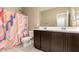 Bathroom with brown cabinets, shower and toilet at 1367 S Country Club Dr # 1295, Mesa, AZ 85210