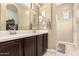 Bathroom with double sink, vanity and walk-in glass shower at 1367 S Country Club Dr # 1295, Mesa, AZ 85210