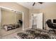 Bedroom featuring large closet mirror and ceiling fan at 1367 S Country Club Dr # 1295, Mesa, AZ 85210