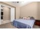 Comfortable bedroom with access to an ensuite bathroom featuring carpet floors at 1367 S Country Club Dr # 1295, Mesa, AZ 85210