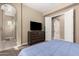 Serene bedroom with ensuite entrance, a dresser, and plush carpet flooring at 1367 S Country Club Dr # 1295, Mesa, AZ 85210