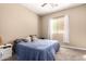 Inviting bedroom with plush carpeting, white curtains, and soft, neutral tones at 1367 S Country Club Dr # 1295, Mesa, AZ 85210