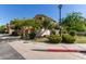 Beautiful home exterior with lush greenery, trees, and a well-kept lawn at 1367 S Country Club Dr # 1295, Mesa, AZ 85210
