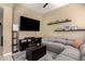 Well-decorated living room with a large television and comfortable sectional sofa at 1367 S Country Club Dr # 1295, Mesa, AZ 85210