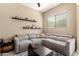 Stylish living room featuring a comfortable sectional sofa and sleek wall shelves at 1367 S Country Club Dr # 1295, Mesa, AZ 85210